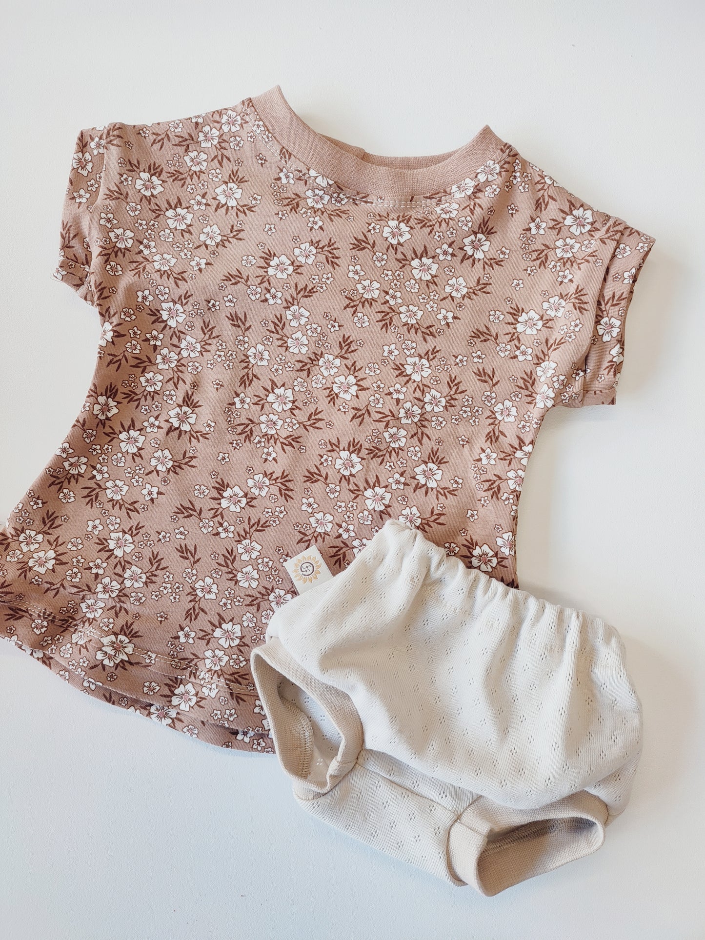 Baby jurk peach bloempjes